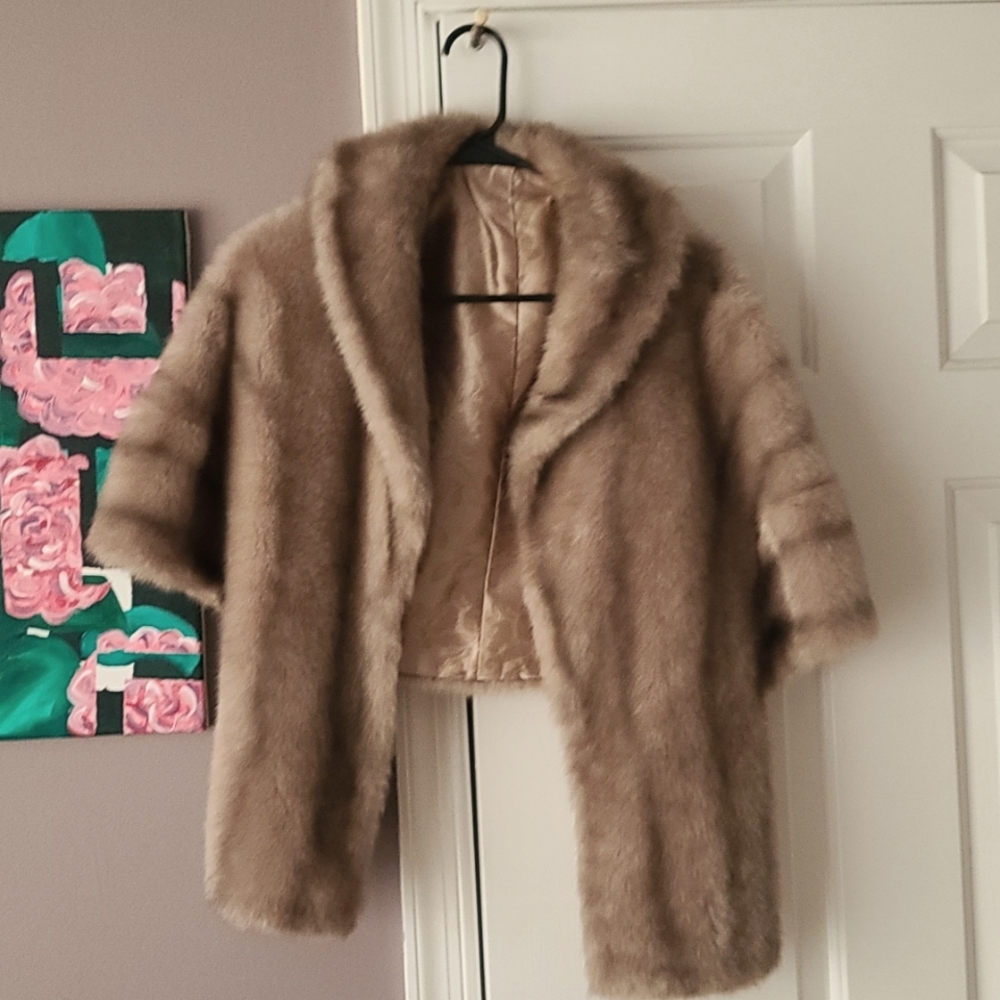 Vintage faux fur shrug with gold lining.